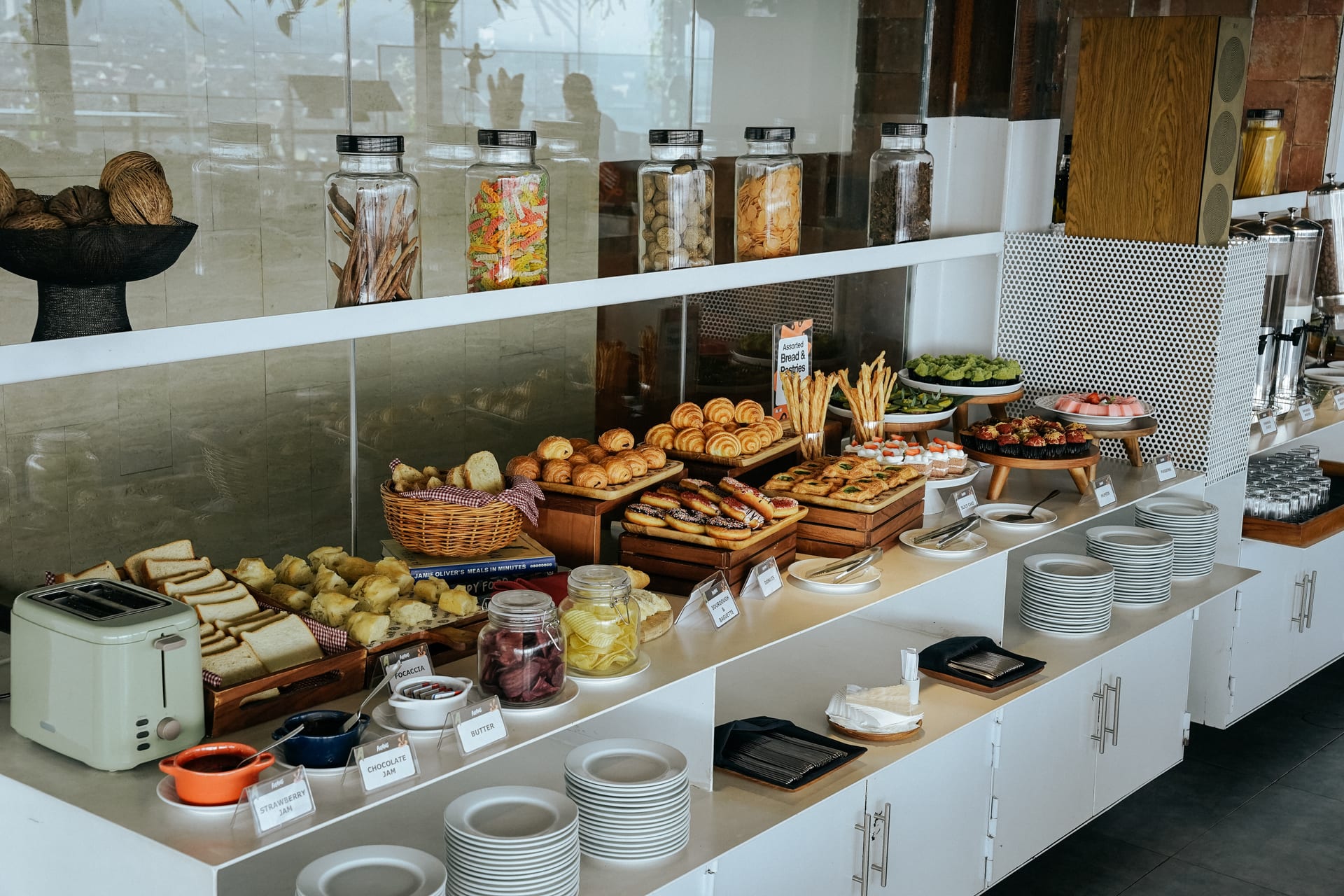 Croissants, breads and pastries lined up along the buffet counter at Alfresco Dining